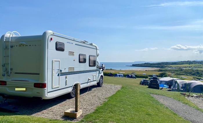 Stunning all-weather serviced pitches suitable for tents, touring caravans and motorhomes